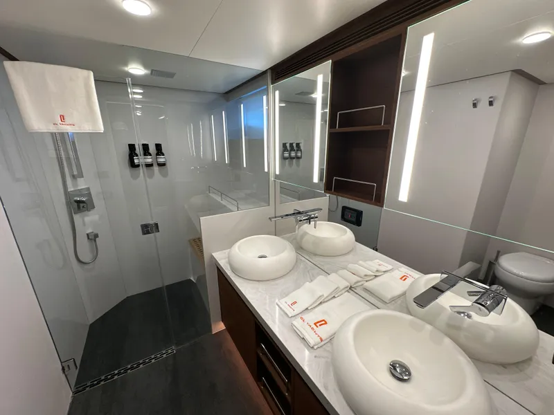 Slide: The Image of Luxurious bathroom in 2023 CL Yachts CLB65, featuring dual sinks and modern shower. - 38
