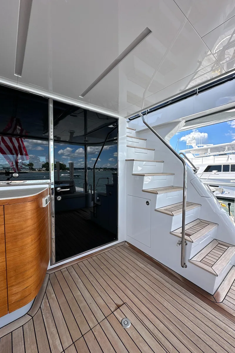 Slide: The Image of 2023 CL Yachts CLB65 yacht deck with stairs and sleek design. - 9