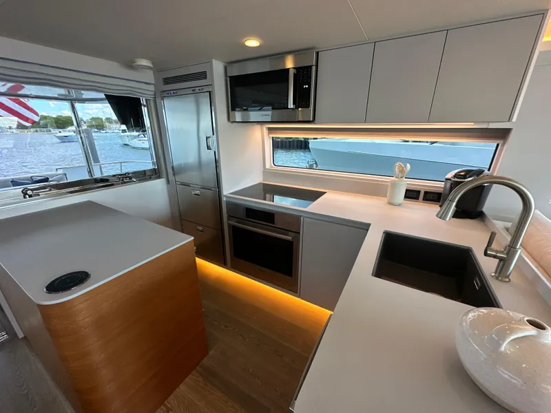 Slide: The Image of Modern kitchen interior of 2023 CL Yachts CLB65 with sleek design and waterfront view. - 23