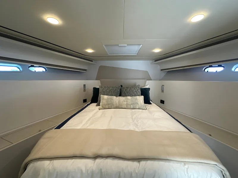 Slide: The Image of Luxurious 2023 CL Yachts CLB65 cabin interior with elegant bedding and ambient lighting. - 39