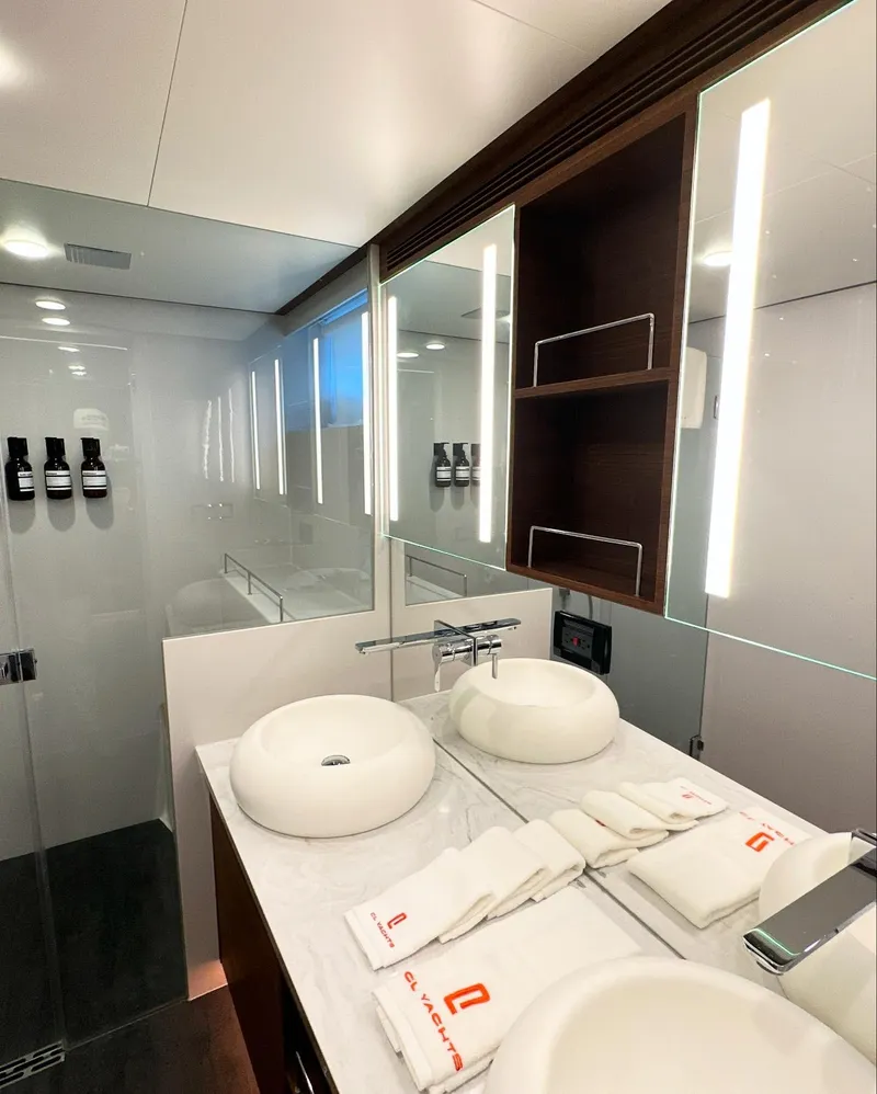 Slide: The Image of Luxurious bathroom in 2023 CL Yachts CLB65, featuring dual sinks and modern lighting. - 42