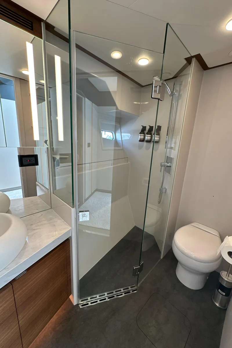 Slide: The Image of Modern bathroom in 2023 CL Yachts CLB65, featuring glass shower and sleek fixtures. - 45