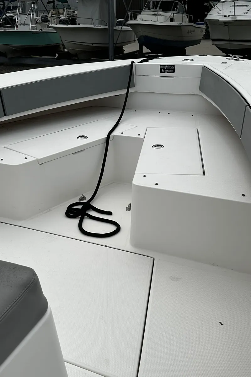 Slide: The Image of 2005 Regulator 32 FS boat interior with seating and rope. - 7