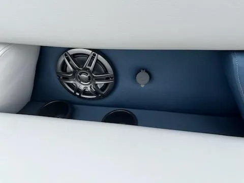 Slide: The Image of Speaker and cup holders in 2025 Godfrey SWEETWATER 2286SFL boat interior. - 10