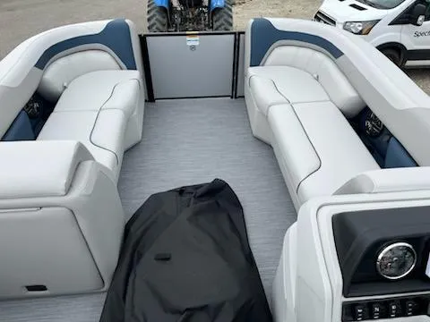 Slide: The Image of 2025 Godfrey SWEETWATER 2286SFL pontoon boat interior with plush seating and modern dashboard. - 17