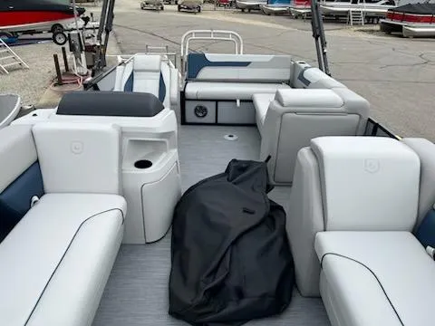 Slide: The Image of 2025 Godfrey SWEETWATER 2286SFL pontoon boat interior with spacious seating and modern design. - 2