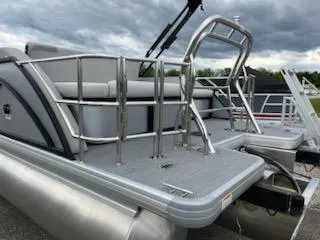 Slide: The Image of 2025 Godfrey SWEETWATER 2286SFL pontoon boat with sleek design and sturdy railings. - 4