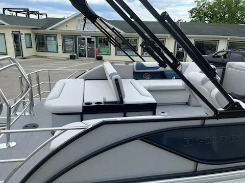 Slide: The Image of 2025 Godfrey SWEETWATER 2286SFL pontoon boat with sleek seating and modern design. - 5