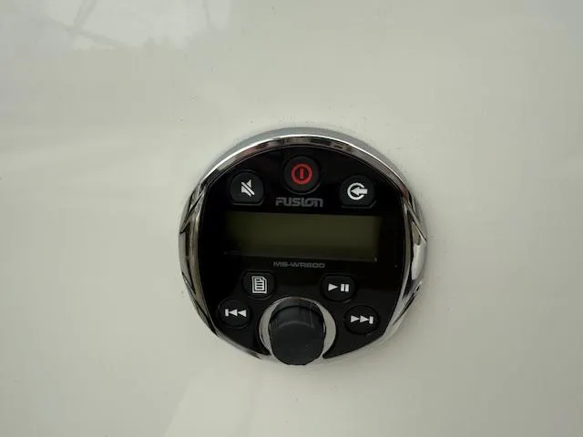 Slide: The Image of Fusion marine stereo control on 2012 Regal 24 FasDeck boat dashboard. - 11