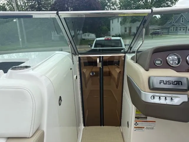 Slide: The Image of Interior view of a 2012 Regal 24 FasDeck boat with dashboard and seating. - 21