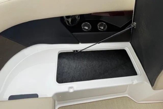 Slide: The Image of 2012 Regal 24 FasDeck boat storage compartment with open hatch. - 26