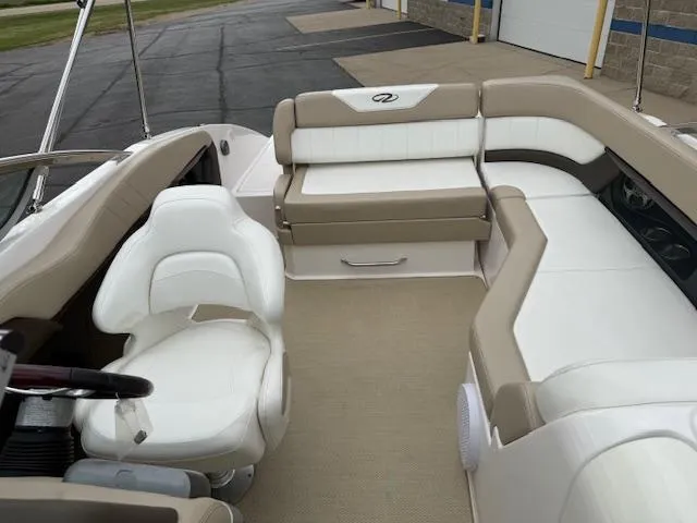 Slide: The Image of Interior of a 2012 Regal 24 FasDeck boat with beige and white seating. - 28