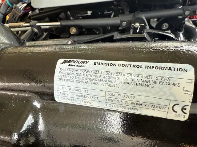 Slide: The Image of Mercury engine emission control label on a 2012 Regal 24 FasDeck boat. - 31