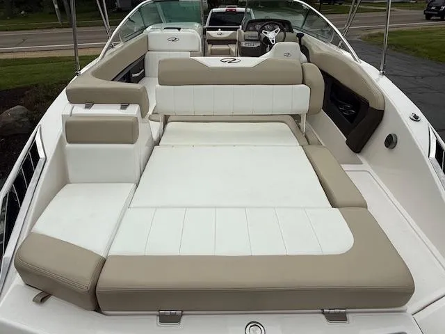 Slide: The Image of 2012 Regal 24 FasDeck boat with spacious beige and white seating area. - 6