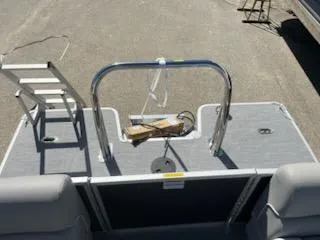 Slide: The Image of 2025 Godfrey EX2286SBCX boat deck with ladder and railing, viewed from above. - 11