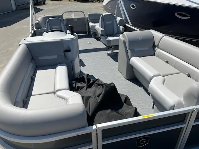 Slide: The Image of 2025 Godfrey EX2286SBCX pontoon boat with spacious seating and modern design. - 3