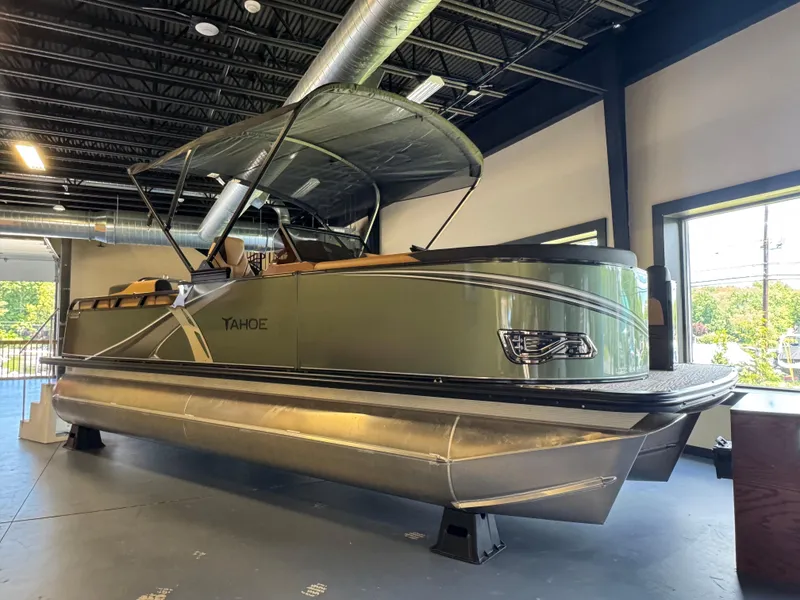 The Image of 2025 Tahoe Pontoon LTZ Elite Windshield in showroom, featuring sleek design and modern amenities. - 0