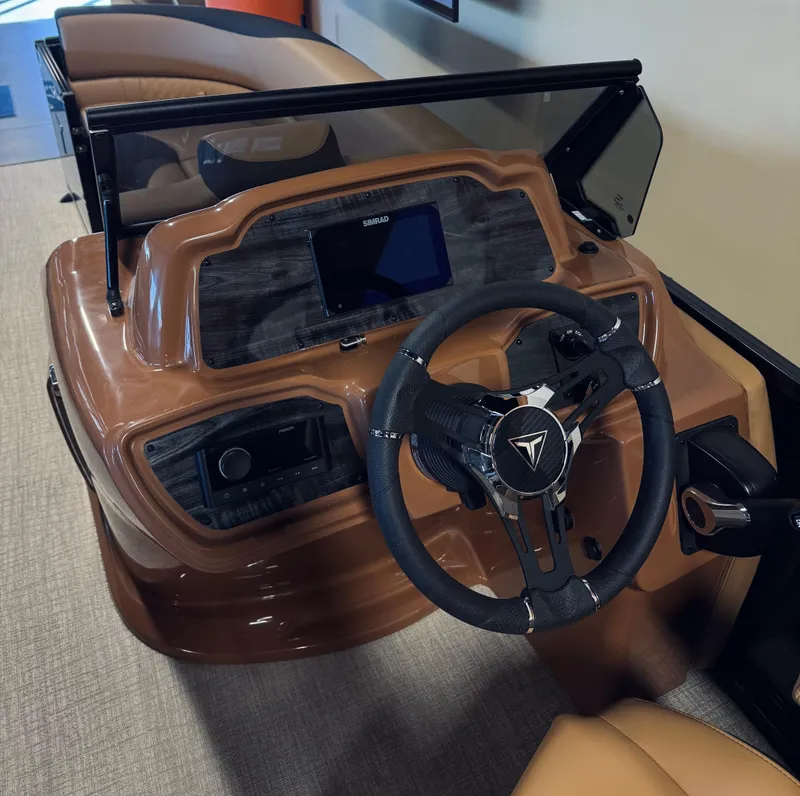 Slide: The Image of 2025 Tahoe Pontoon LTZ Elite Windshield dashboard with steering wheel and controls. - 5
