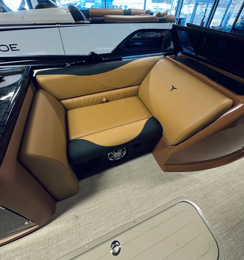 Slide: The Image of 2025 Tahoe Pontoon LTZ Elite Windshield interior with tan and black seating. - 9
