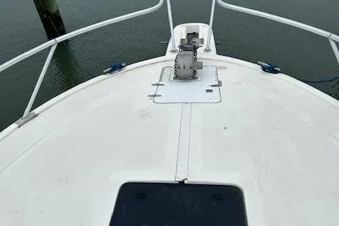 Slide: The Image of Bow of 1992 Luhrs Tournament 290 Open boat with anchor and railing. - 11