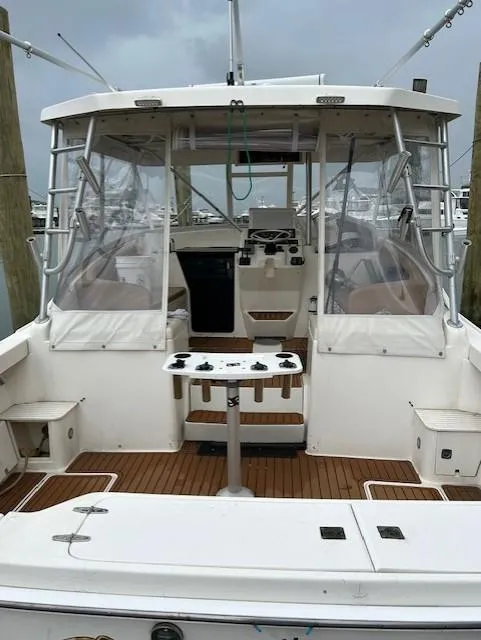 Slide: The Image of 1992 Luhrs Tournament 290 Open boat with spacious cockpit and fishing setup. - 3
