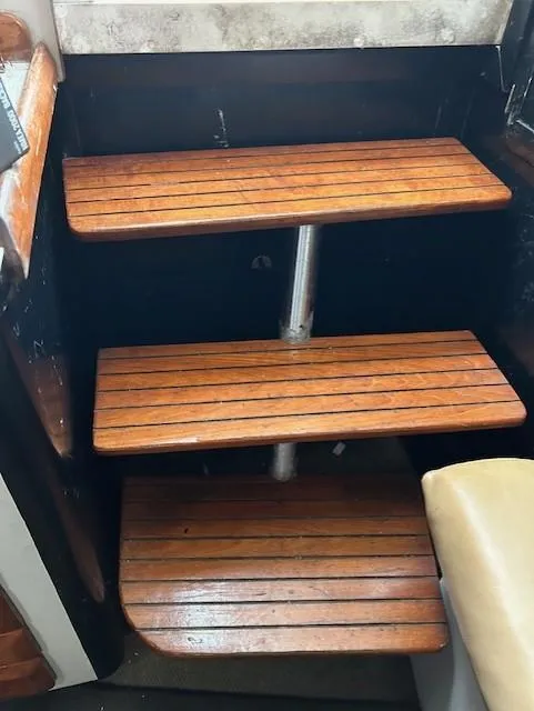 Slide: The Image of Wooden steps inside a 1992 Luhrs Tournament 290 Open boat. - 7