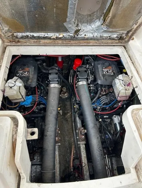 Slide: The Image of Engine compartment of 1992 Luhrs Tournament 290 Open boat, showing dual engines and components. - 9