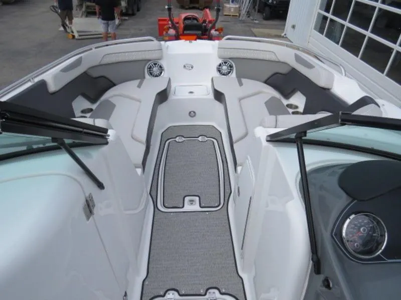 Slide: The Image of 2023 Hurricane SunDeck 2400 OB boat interior with seating and speakers. - 11