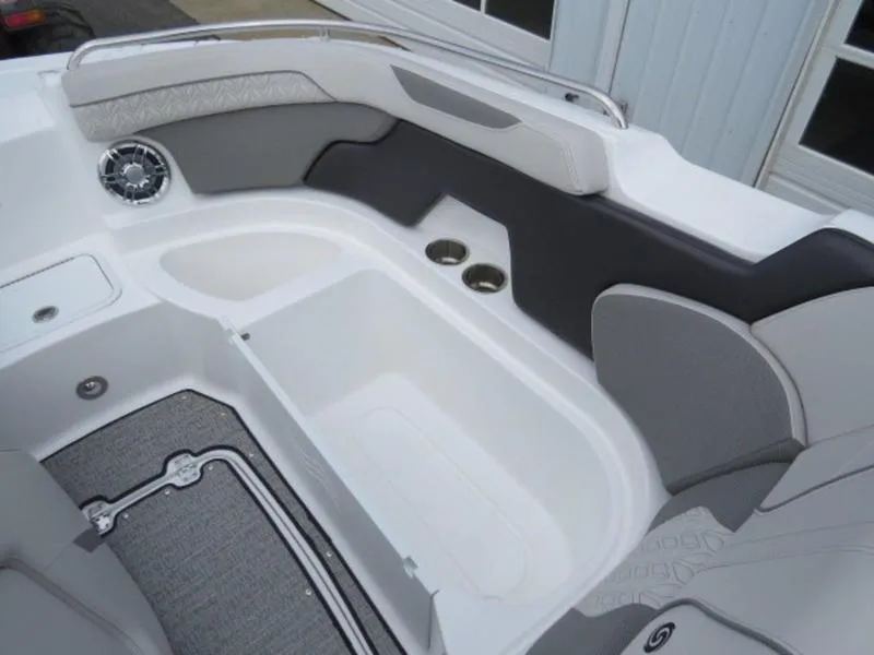Slide: The Image of 2023 Hurricane SunDeck 2400 OB boat interior with seating and cup holders. - 13