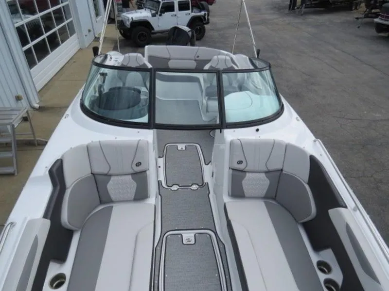 Slide: The Image of 2023 Hurricane SunDeck 2400 OB boat with spacious seating and sleek design. - 21