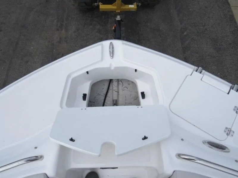 Slide: The Image of 2023 Hurricane SunDeck 2400 OB boat deck, featuring storage compartments and sleek design. - 27