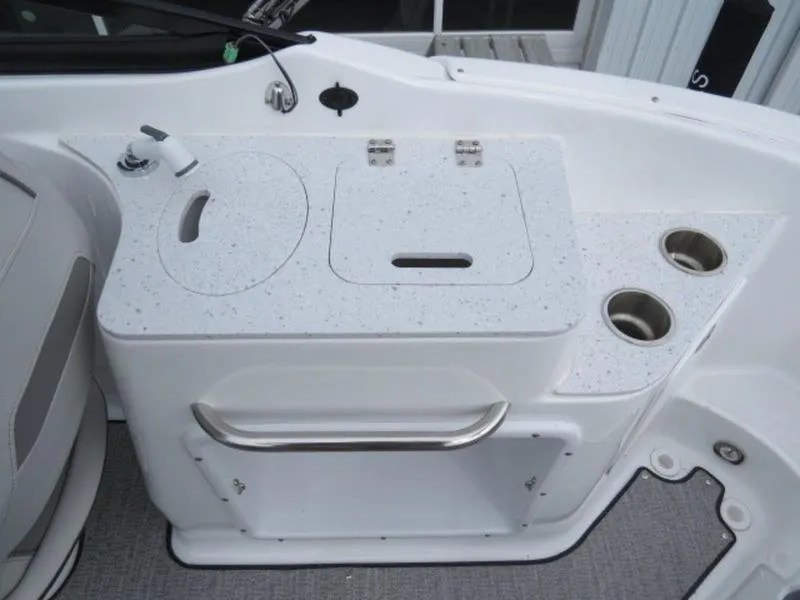 Slide: The Image of 2023 Hurricane SunDeck 2400 OB boat interior with sink and cup holders. - 29