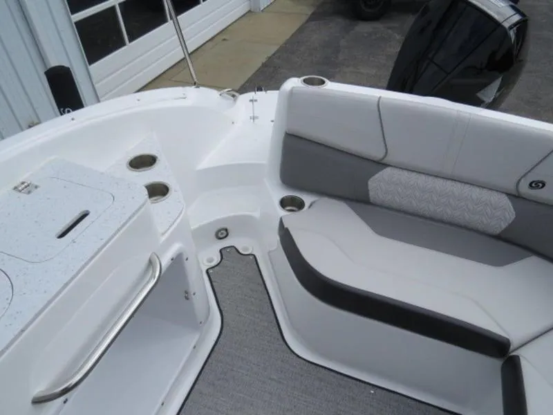 Slide: The Image of 2023 Hurricane SunDeck 2400 OB boat interior with seating and cup holders. - 3