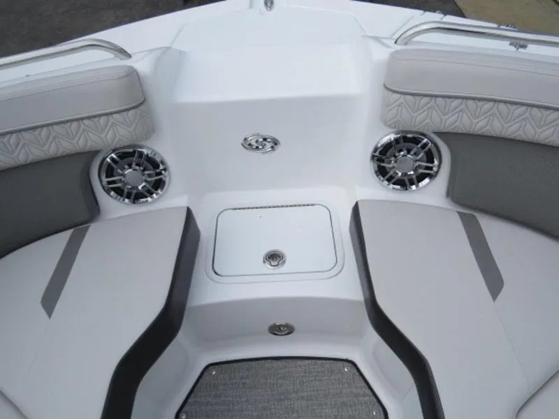 Slide: The Image of 2023 Hurricane SunDeck 2400 OB boat interior with cushioned seating and speakers. - 30