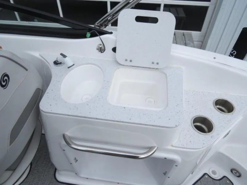 Slide: The Image of 2023 Hurricane SunDeck 2400 OB boat sink and countertop with cup holders. - 7
