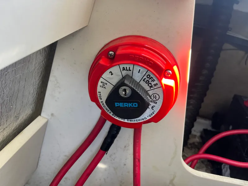 Slide: The Image of Red Perko battery switch in a 2008 Crownline 23SS boat, showing multiple settings. - 15