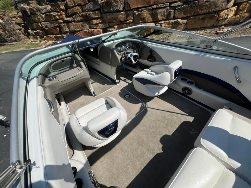 Slide: The Image of 2008 Crownline 23SS boat interior with white seating and modern dashboard. - 22