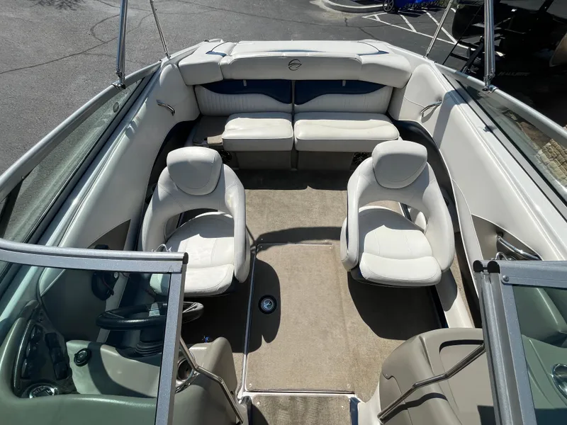 Slide: The Image of Interior of 2008 Crownline 23SS boat with white seating and steering wheel. - 9