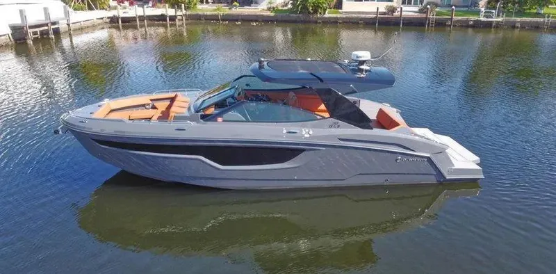 Slide: The Image of 2023 Cruisers Yachts 38 GLS luxury boat on calm water. - 0