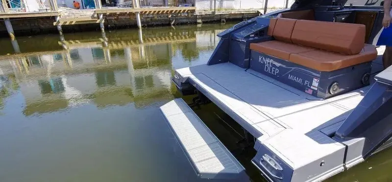 Slide: The Image of 2023 Cruisers Yachts 38 GLS with swim platform, docked in calm waters. - 9