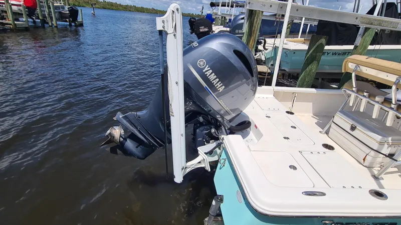 Slide: The Image of 2016 Tidewater 2200 Carolina Bay boat with Yamaha outboard motor in water. - 17