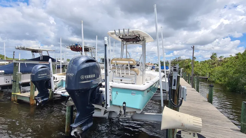 Slide: The Image of 2016 Tidewater 2200 Carolina Bay boat docked with Yamaha outboard motor. - 5