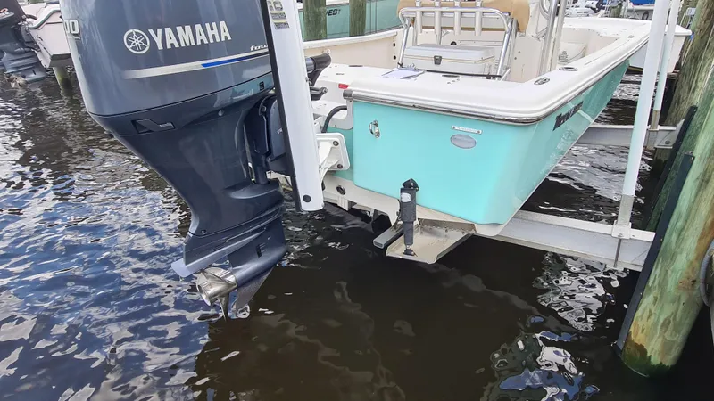 Slide: The Image of 2016 Tidewater 2200 Carolina Bay boat with Yamaha outboard motor on water. - 6