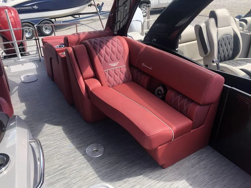 Slide: The Image of Luxurious red seating on 2021 Bennington 23 RCWA pontoon boat interior. - 3