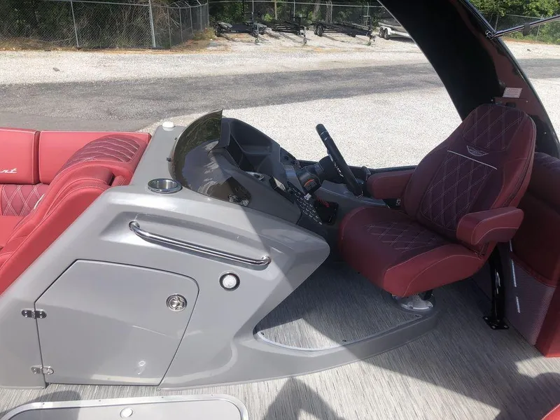 Slide: The Image of 2021 Bennington 23 RCWA boat interior with red seating and sleek gray console. - 5