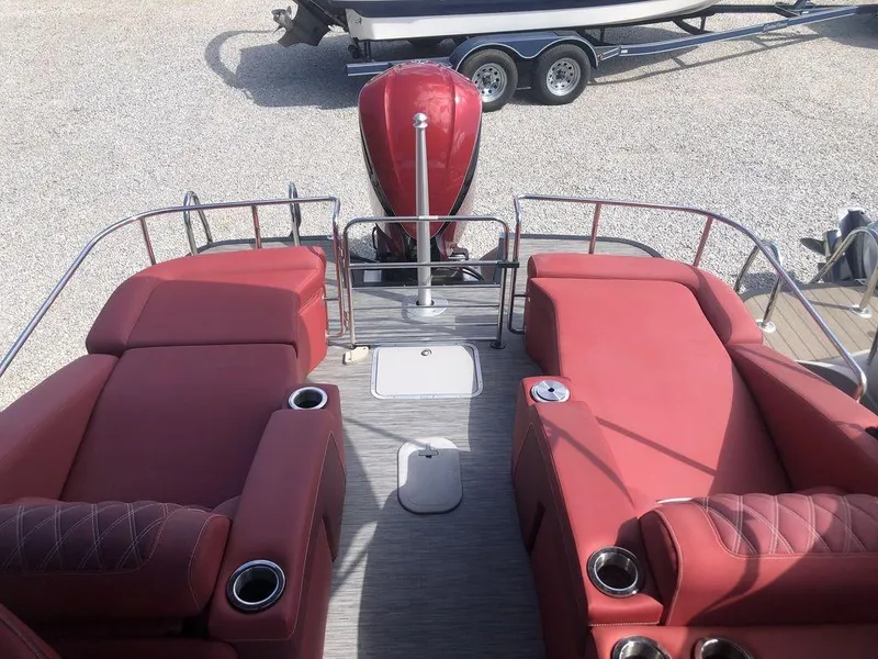 Slide: The Image of 2021 Bennington 23 RCWA boat with red seating and cup holders, viewed from above. - 6