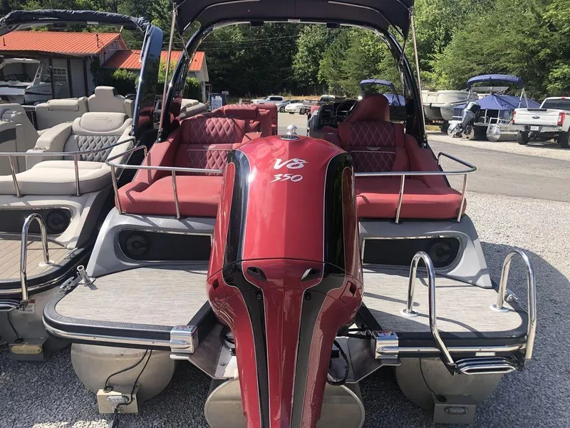 Slide: The Image of 2021 Bennington 23 RCWA pontoon boat with V6 350 engine, docked outdoors. - 7