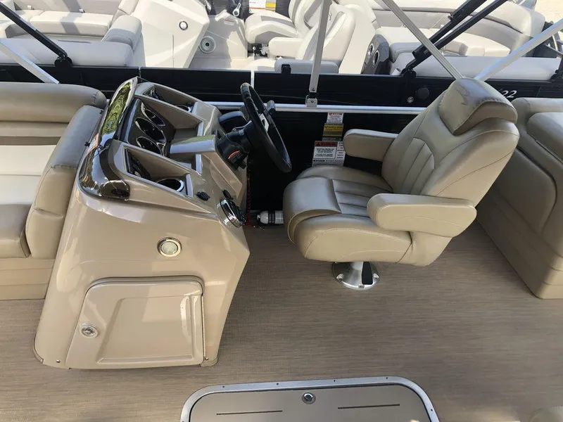Slide: The Image of 2017 Bennington 24SSRX boat interior with captain's chair and control console. - 5