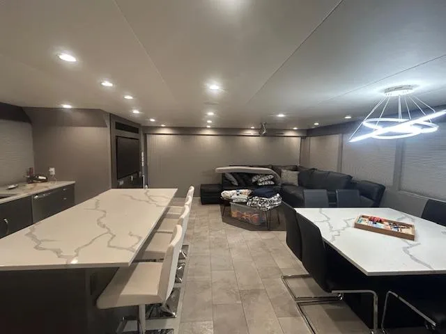 Slide: The Image of Modern interior of 2020 Adonia houseboat with sleek kitchen and cozy seating area. - 16