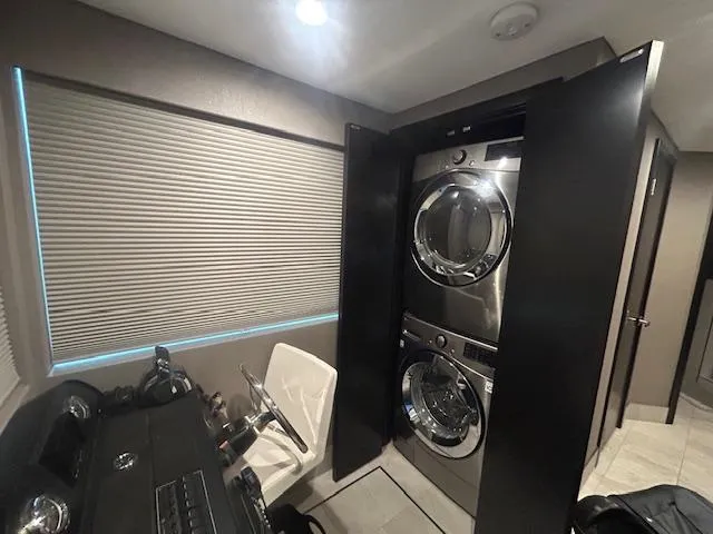 Slide: The Image of Stacked washer and dryer in 2020 Adonia houseboat interior with modern design. - 4